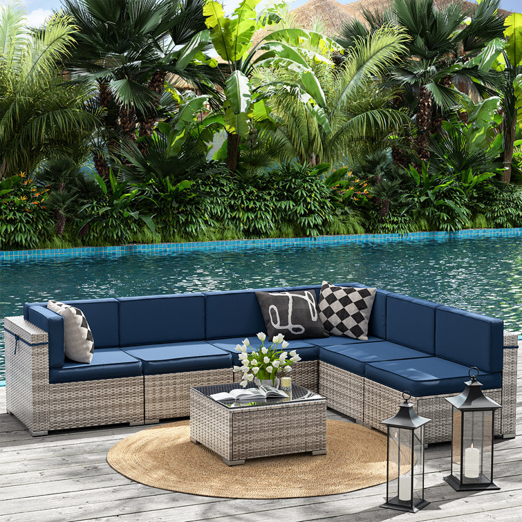 Marenna 7 Piece Rattan Sectional Seating Group with Cushions